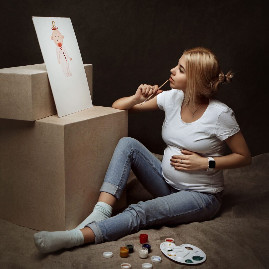 pregnant woman painting